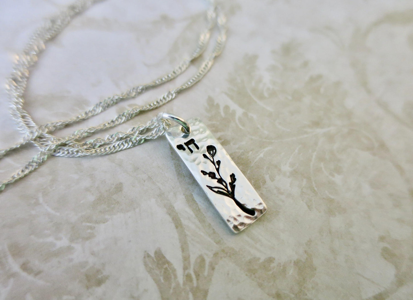 Chai Hebrew Necklace with Jasmine Floral Accent