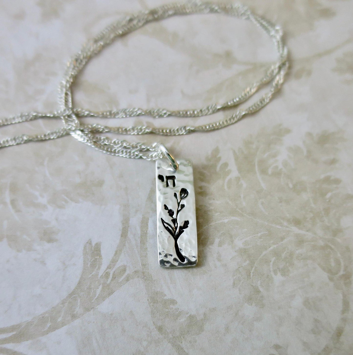 Chai Hebrew Necklace with Jasmine Floral Accent